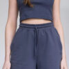 Майка-топ з еластичного трикотажу в дрібноий рубчик підійде і для спортивних, і для повсякденних образів.